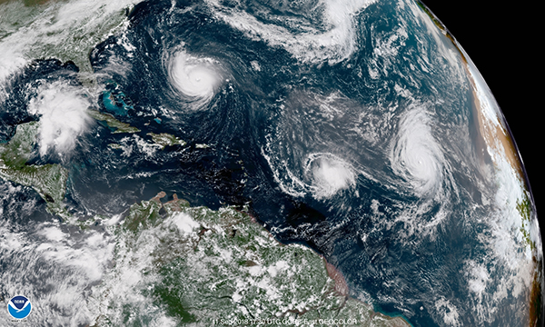 GOES East GeoColor satellite image of the Atlantic Ocean on September 11, 2018 showing Hurricanes Florence (L) and Helene (R) and Tropical Storm Isaac (center). Photo Credit: NOAA/NESDIS