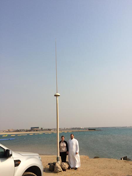 Zdenka and Khaled Asfahani stand next to HFR antenna on the Red Sea coast.