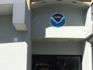 NOAA logo above a doorway on a white office building
