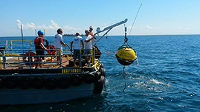 buoy ready for deployment, hanging from boat stern